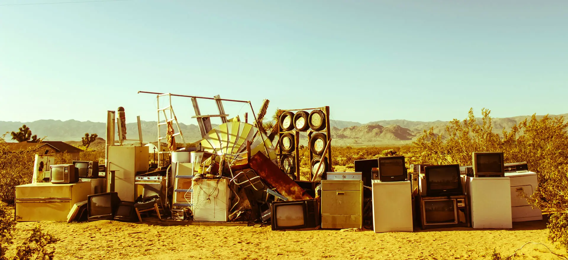 A pile of junk sitting in the middle of nowhere.